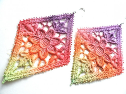 Tie dye / rainbow lace earrings made by White Bear Accessories on Etsy.