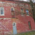When Max sent me these photos, she wrote, "I'm hoping that there was once a porch or stairway at that 2nd story door!" Me too, Max, me too! I think I see a faint outline of steps going up to the upper door. When Max sent me these photos, she wrote, "I'm hoping that there was once a porch or stairway at that 2nd story door!" Me too, Max, me too! I think I see a faint outline of steps going up to the upper door.