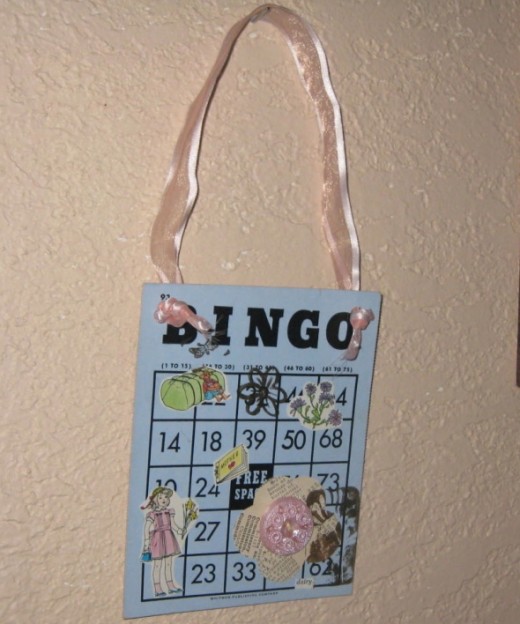 Bingo card art collage with vintage book illustration clip art and vintage button.