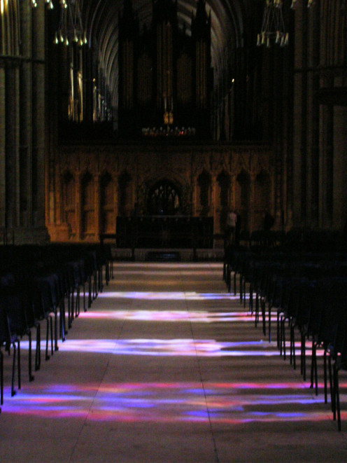 Photo of Lincoln Cathedral nave taken with my Nikon digital camera in 2005. Stained glass produces beautiful lighting effects on the floor.