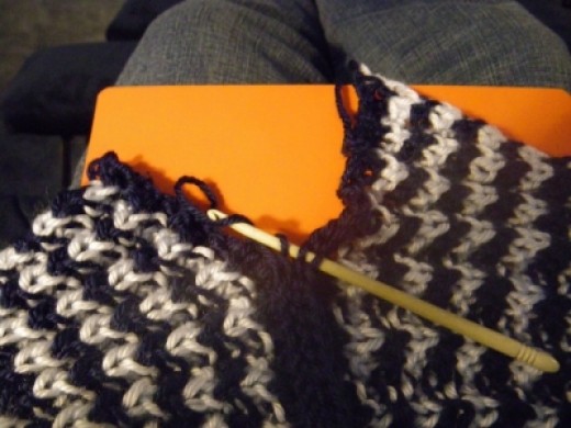 Knit right and left sides of scarf. Then sew them together to form a long scarf. Mine is longer than suggested
