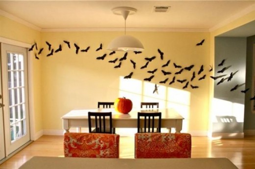 Bats flying through the dining room. Featured on DIY Halloween Wall Decor.
