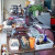 Organizing garage sale items on tables inside the garage Organizing garage sale items on tables inside the garage