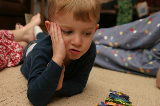 This little boy is learning math as he plays with his matchbox cars... Used under creative commons