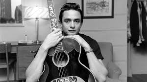 young Johnny Cash and his guitar