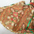 Reverse of tree skirt with green ribbon Reverse of tree skirt with green ribbon