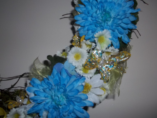 Fill in spaces with additional flowers and leaves