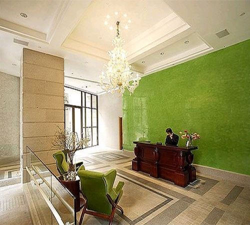 This is another great example of how effective a little bright color can be when used to define a space.  In this case, a little lime green is used to define the very large mostly-neutral space of the lobby of the Lanson Place Hotel in Hong Kong.  Sp