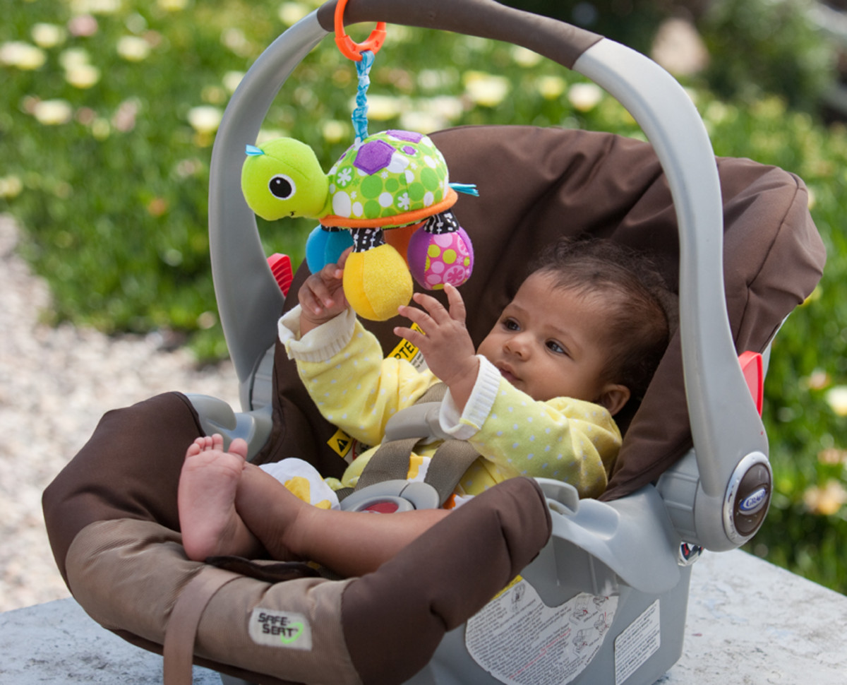 Attach it to a car seat or layette.  Photo by Infantino.