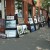 Pedestrians enjoying the work of several artists along Whyte Ave.