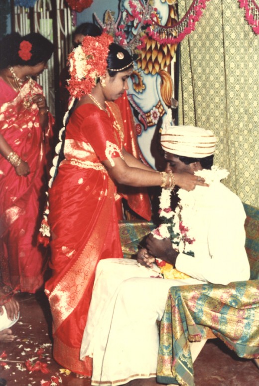 Bride garlanding the groom.