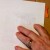 The back of the photo with the tab showing thru. Apply the clear tape over the tab. The back of the photo with the tab showing thru. Apply the clear tape over the tab.