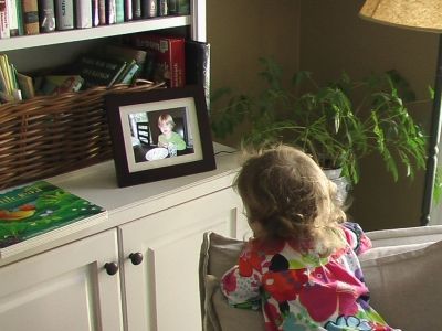 My Grand-daughter watching the Show on the Digital Photo Frame